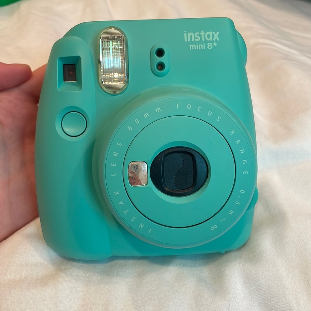 Polaroid camera, camera case, and 2 packs of film